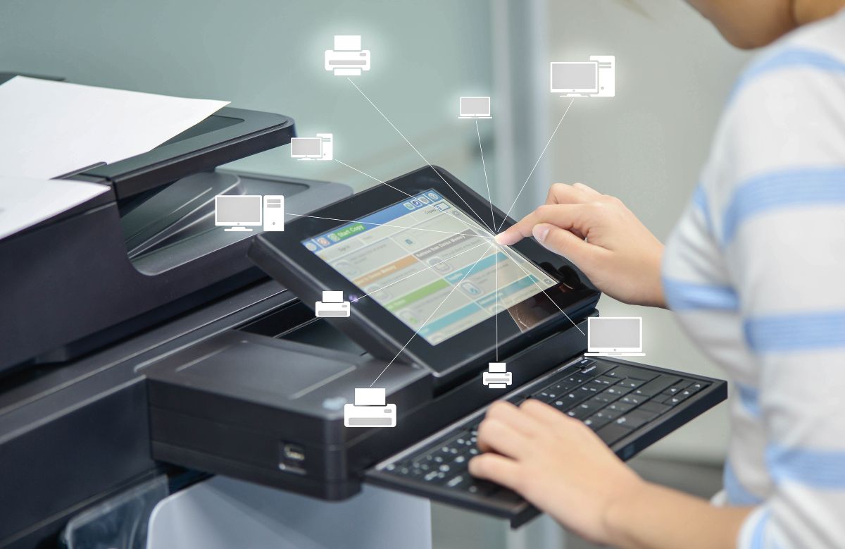 Portland business woman is using the printer to scan document to network folder with icon of printer and computer